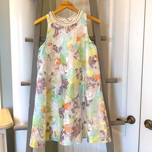 Woman’s beautiful A Line dress with Pearl neck